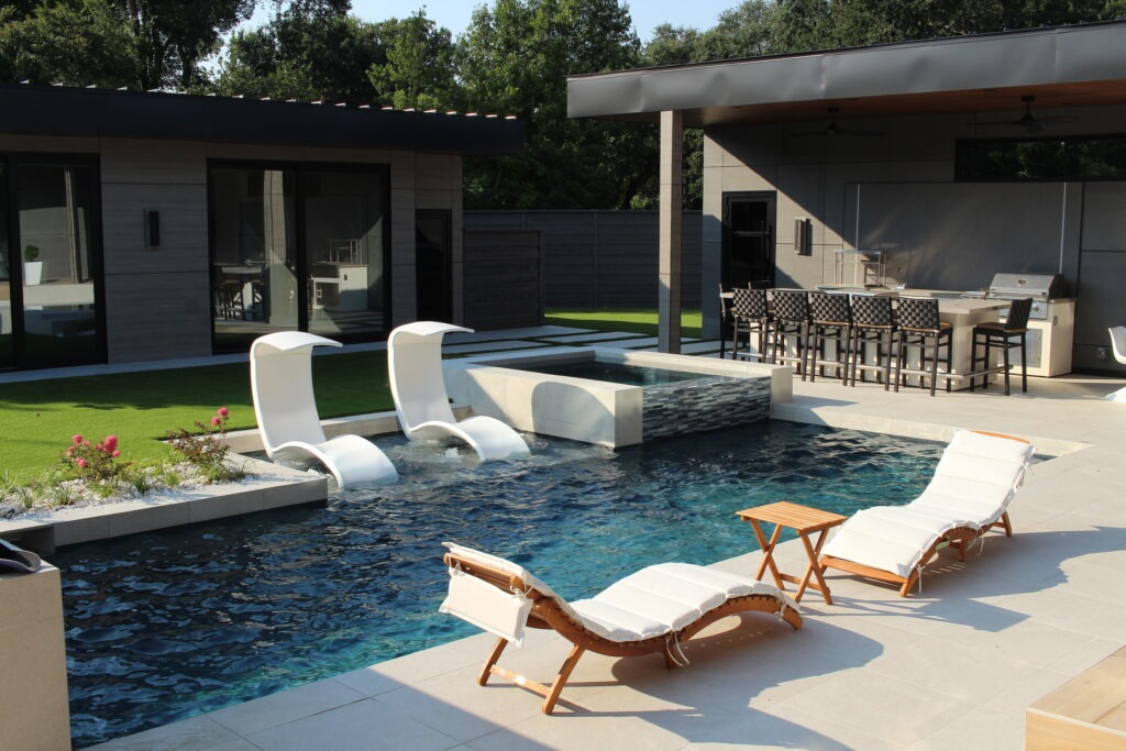 Pool with in-water loungers and a covered outdoor entertaining area